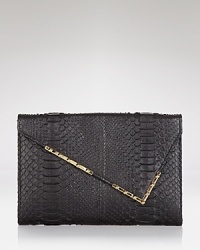 Be & D perfects night-right accessorizing with this embossed leather clutch. Tuck it under your arm to snake, rattle, and roll.