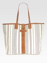 Set sail with this nautical-inspired design made of rich striped canvas, finished with sumptuous leather top handles and trim. Double leather top handles, 9 dropBuckled magnetic flap closure with logo emblemOne inside zip pocketTwo inside open pockets15W X 13H X 5½DImported