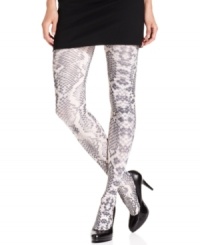 Revel in the reptilian rave with these python print tights from HUE. Luxuriously opaque and decidedly eye-catching, they add a pop of playful style to day or evening attire.