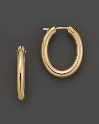 Classic oval hoop earrings in yellow gold. Designed by Roberto Coin.