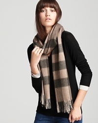 Black and beige and Burberry all over, this boldly elegant cashmere scarf works well with neutrals and colors alike.