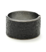 Not so basic black. A glitter finish adds a dazzling design detail to Haskell's wide bangle bracelet. Including a hinge closure, it's crafted in hematite tone mixed metal. Approximate length: 7-1/2 inches.