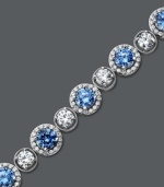 Perfect your party look with plenty of shine. Arabella's glamorous tennis bracelet combines round-cut blue and white Swarovski zirconias (22-9/10 ct. t.w.) for a look that's completely brilliant. Crafted in sterling silver. Approximate length: 7 inches.