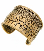 Ssseriously ssstylish! Embossed python has an exotic effect on this chic cuff bracelet from T Tahari. Embellished with sparkling Colorado crystals, it's crafted in gold tone mixed metal and nickel-free for sensitive skin. Approximate diameter: 2-1/2 inches.