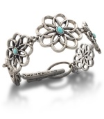 Keep the enchantment of wildflowers at hand with this sweet Lucky Brand bracelet. Flower links carved from distressed silver tone mixed metal feature semi-precious reconstituted calcite turquoise stones at center. Approximate length: 7-1/2 inches long.