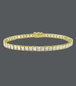 Add an element of luxury to your look with a luminous bracelet. B. Brilliant design features a row of round-cut, channel-set cubic zirconias (10 ct. t.w.) set in 18k gold over sterling silver. Approximate length: 7-1/4 inches.