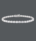 Streamline your style with a hint of sparkle. B. Brilliant's luminous tennis bracelet features a row of round-cut cubic zirconias (8-1/4 ct. t.w.) set in sterling silver. Approximate length: 7-1/4 inches.