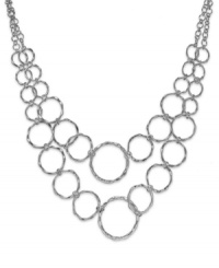 Add a captivating look to your attire with this circle link necklace from Sequin. Crafted in silver tone mixed metal. Approximate length: 15 inches + 3-inch extender. Approximate drop: 3 inches.