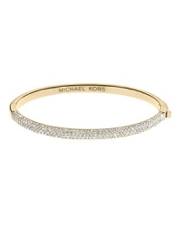 The charm of this thin Michael Kors bangle is all in the details--from the pave crusted front piece to the interior logo inscription.