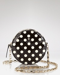 Get spotted: This kate spade new york crossbody hits the dot with its coolly circular shape, finished in glossy, printed patent leather.