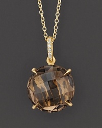 Pavé diamonds and smoky quartz sparkle in a 18K yellow gold setting.