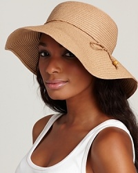 Exuded elegance in a natural floppy hat with woven tie trim.