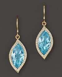 Pavé diamonds frame faceted blue topaz, set in 18K gold leaves. By Carelle.