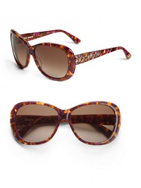 THE LOOKRounded square silhouetteVariegated handmade acetate framesEtched grid and Austrian crystals on temples, arms and tipsTHE COLORBrown and amethyst with brown gradient lensORIGINImported