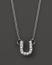 From the Tiny Treasures collection, a diamond U necklace. With signature ruby accent. Designed by Roberto Coin.