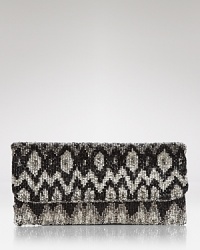 A bohemian Ikat motif is effortlessly glamorous on this beaded MOYNA clutch, styled in a slim fold-over silhouette.