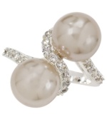 Wrap your fingers in the finest elegance. City by City's shimmering ring combines two glass pearls cradled in a seamless row of sparkling clear cubic zirconias (1/4 ct. t.w.). Set in silver tone mixed metal. Size 7.