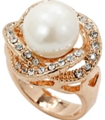 True elegance. The swirling setting of City by City's sophisticated ring style provides the perfect cradle for a simulated pearl and sparkling round-cut crystals. Set in gold tone mixed metal.