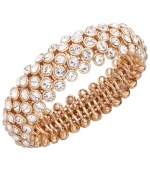 Slip on some blush tones that add life to any look. Charter Club's chic beaded style features clear glass accents in rose gold tone mixed metal. Bracelet stretches to fit wrist. Approximate diameter: 2-1/4 inches.