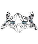 Wrap your wrist in butterfly after butterfly. Fossil's mixed metal bracelet links together vintage silver tone openwork butterflies that are accented by semi-precious turquoise stones. A lobster claw closure holds everything together. Approximate length: 7-3/4 inches.