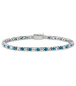 Polish and a pop of color. B. Brilliant's pretty tennis bracelet features alternating London blue cubic zirconias and clear cubic zirconias (5 ct. t.w.) set in sterling silver. Approximate length: 7-1/2 inches.