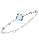 Bangle love. You'll adore Victoria Townsend's sterling silver bangle, with its square-cut blue topaz (3-1/4 ct. t.w.) and sparkling diamond accents. Approximate circumference: 8 inches.