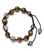 Spiritual-inspired bracelets are all the rage this season! Snap up this hot style from Ali Khan featuring semi-precious tiger's eye beads and pave glass fireballs on a trendy black cord. Bracelet adjusts to fit the wrist. Approximate diameter: 2 inches. Approximate length: 12-1/4 inches.