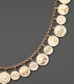 A stunning exchange rate! This charm bracelet features graduated European coins on rolo bracelet. Set in 14k gold.  Measures 8.