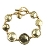 Encircle your wrists in style that stands out. Bracelet by Jones New York features a chic, circular design and toggle clasp. Crafted in gold tone mixed metal. Approximate length: 7-3/4 inches.