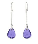 Pretty in purple: Striking tanzanite-colored stones adorn Swarovski's linear drop crystal earrings. They're an eye-catching element to enhance any outfit. Crafted in silver tone mixed metal. Approximate drop: 3-1/8 inches.