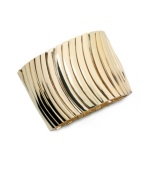 Catch the next wave of great style with Alfani's wavy stretch bracelet. Wear it to work or on weekends for a unique, eye-catching look. Crafted in gold tone mixed metal. Bracelet stretches to fit wrist. Approximate diameter: 7-1/2 inches.