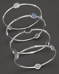 Three sparkling stations add brilliant color to this slim, elegant sterling silver bangle.