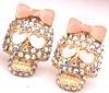 DaisyJewel Light Sparkle Skull Earrings - Betsey Johnson Top Seller Iridescent Slayer / Reaper Rainbow - Clear Crystal Encrusted Sugar Skull Calavera Stud Earrings with Heart Shaped Eyes & Pink Enamel Bow- Skin-Safe Gold / Metal Alloy - Posts & Backs - Fo