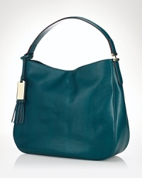 Silly-smooth leather covers a slouchy, effortless Lauren Ralph Lauren handbag. A simple shoulder strap arcs over a center snap closure, and the roomy interior has 3 pockets.