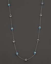 This bold sterling silver lstation necklace gleaming with blue quartz, is a brilliant showcase for Di MODOLO's iconic Triadra design.