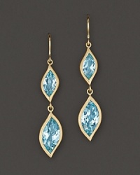 Pavé diamonds frame faceted blue topaz, set in 18K gold leaves. By Carelle.