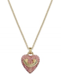 Love that glitters. Juicy Couture's pendant necklace features a darling heart charm embellished with pink pave crystals. Finished with a gold tone logo banner. Crafted in gold tone mixed metal. Approximate length: 30 inches + 3-inch extender. Approximate drop: 1 inch.