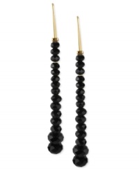 Kenneth Cole New York proves to be well-rounded with this pair of drop earrings. Crafted from gold-tone mixed metal and featuring black beads, this linear set makes a bold, yet subtle statement. Approximate drop: 2-1/4 inches.