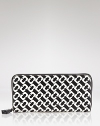 Compact style goes bold with this printed wallet from DIANE von FURSTENBERG. In the brand's signature graphics, this practical piece is almost too pretty to hide inside your purse.