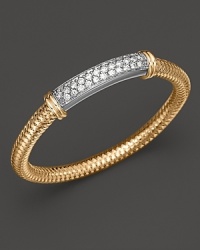 A modern 18K gold mesh bangle with dazzling diamond bar from Roberto Coin.