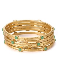 The easiest way to shine on - and the perfect accent to any look. We're wearing this set of hammered gold plated bangles from Lauren Ralph Lauren, stylishly stacked.