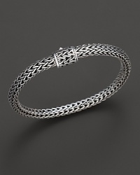 Small sterling woven chain bracelet with carved chain clasp, designed by John Hardy.