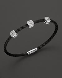 From the Celtic Noir Collection, a stackable bangle in white gold and and black PVD with diamond stations. Designed by Charriol.