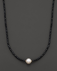 Black onyx beaded necklace with a single freshwater pearl.