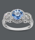 Elegance defined. Arabella's stunning three stone ring highlights a round-cut blue Swarovski zirconia (2-1/4 ct. t.w.) and dozens of round-cut white zirconias (1-1/8 ct. t.w.). Crafted in sterling silver. Size 7.