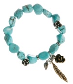 Embrace your natural side. Lucky Brand's free-spirited bracelet combines semi-precious reconstituted calcite turquoise with flower and feather charms in mixed metal. Elastic bracelet stretches to fit wrist. Approximate diameter: 2-3/4 inches.