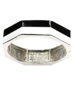 Earn your stripes with this trendy style. Nine West's chic colorblock bangle is perfect for stacking with its black and white enamel design and silver tone mixed metal setting. Bracelet stretches to fit wrist. Approximate diameter: 2-1/2 inches.