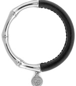 One part Zen and one part colorblock equals two parts fabulous! Jessica Simpson's totally-chic bangle features a serene bamboo setting in silver tone mixed metal combined with stretchable black polyurethane. Approximate length (when stretched): 10 inches.