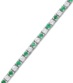 Show your true colors. A sweet mix of round-cut white sapphires (2-1/2 ct. t.w.) and emeralds (2 ct. t.w.) create a seamless row of sparkle on this stunning sterling silver bracelet. Approximate length: 7 inches.