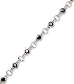 Stunning in sapphire. Victoria Townsend's standout tennis bracelet features round-cut sapphires (5 ct. t.w.) and sparkling diamond accents. Crafted in sterling silver. Approximate length: 7 inches.